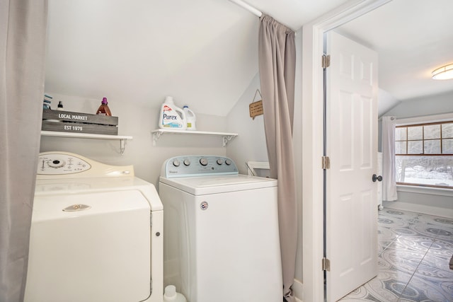 washroom featuring tile patterned floors and washer and dryer