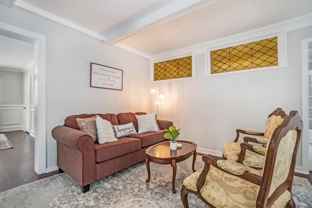 living room featuring beam ceiling, crown molding, and hardwood / wood-style flooring