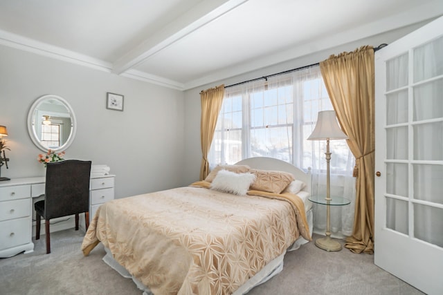 carpeted bedroom featuring beamed ceiling and crown molding