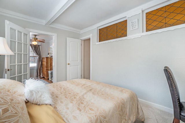 carpeted bedroom with beamed ceiling and ornamental molding