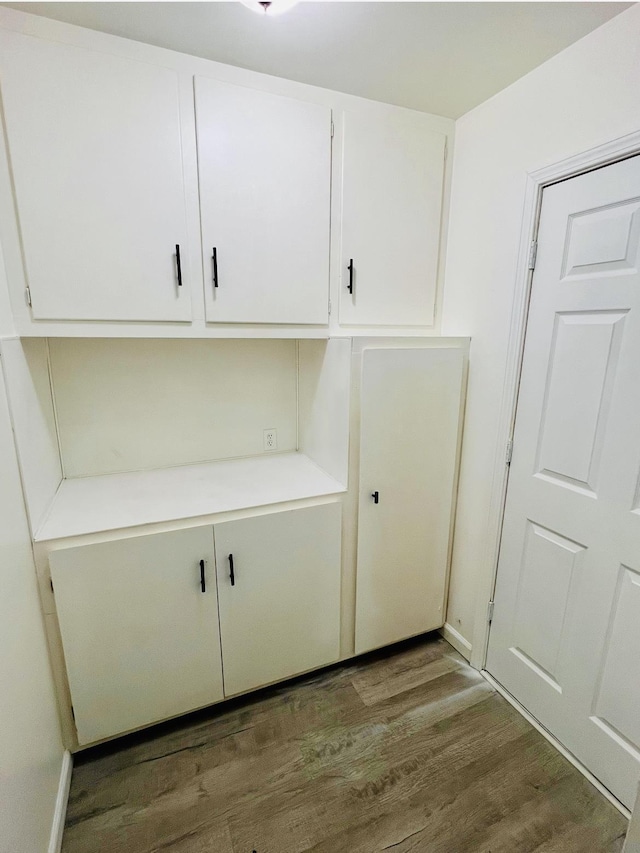 washroom with dark hardwood / wood-style floors