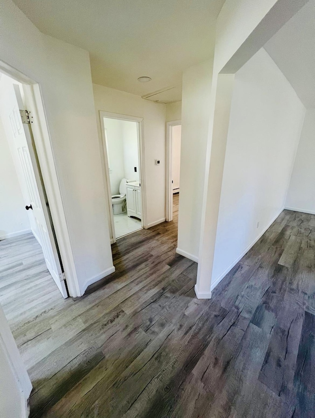 corridor with dark hardwood / wood-style floors