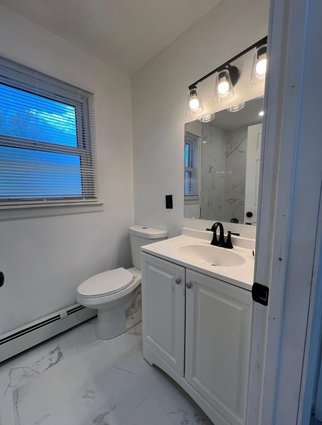 bathroom with toilet, a shower, a baseboard heating unit, and vanity