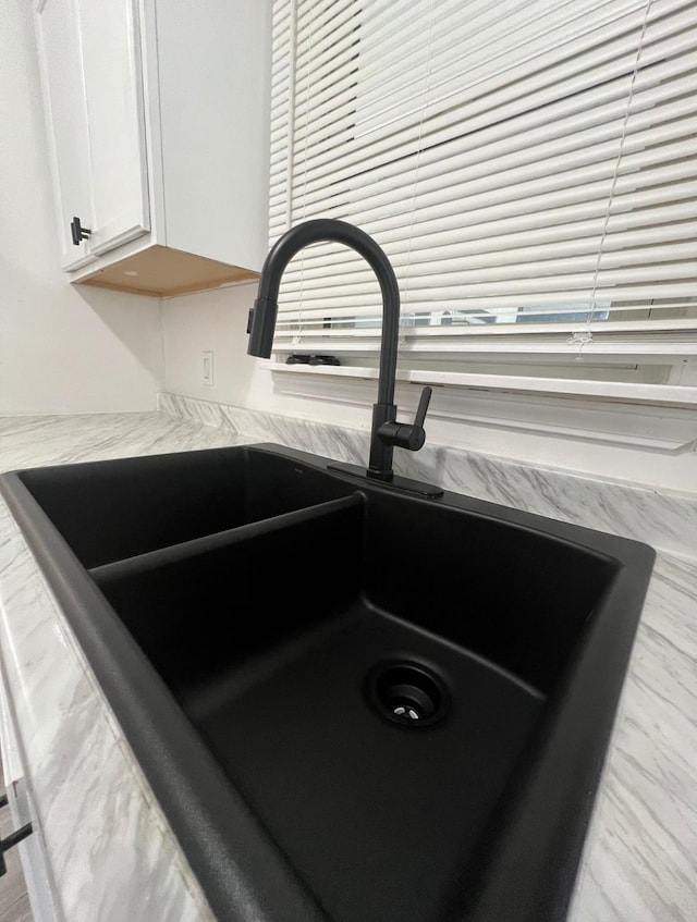 details with sink and white cabinetry