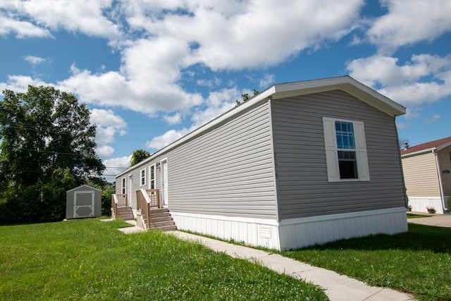 view of property exterior with a lawn and a storage shed