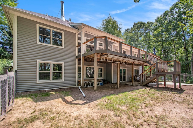 rear view of property with a wooden deck