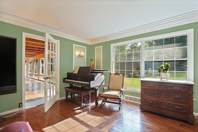 sitting room with french doors, hardwood / wood-style flooring, and ornamental molding