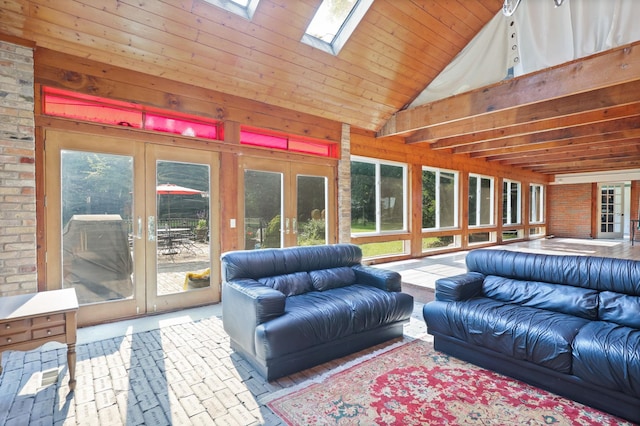 sunroom / solarium with french doors and lofted ceiling with skylight