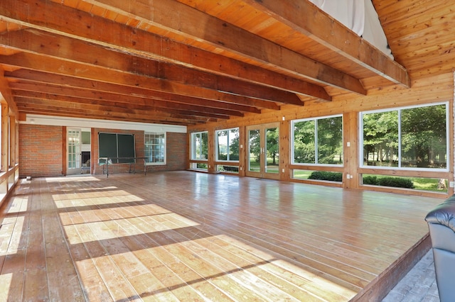 unfurnished sunroom featuring lofted ceiling with beams and wood ceiling