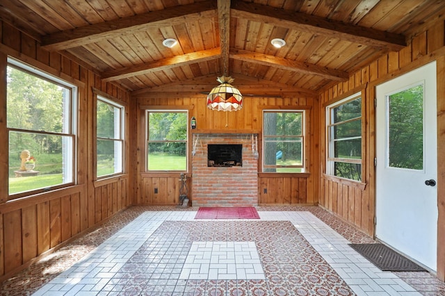 unfurnished sunroom with vaulted ceiling with beams and wooden ceiling