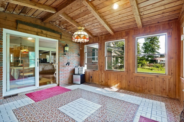 sunroom / solarium featuring vaulted ceiling with beams and wooden ceiling