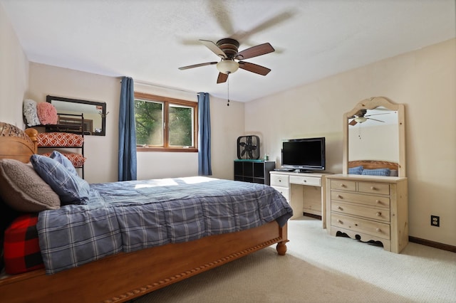 bedroom featuring light colored carpet and ceiling fan