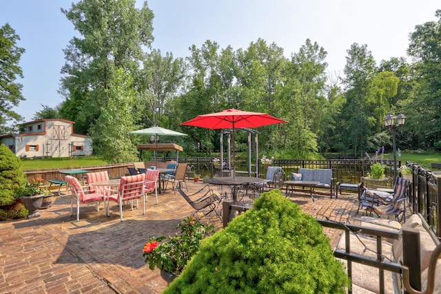 4705 Weiss Rd, Frankenmuth, MI 48734 - view of patio / terrace featuring view of scattered trees, outdoor dining area, and an outdoor living space