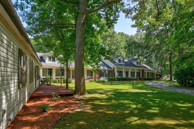 4705 Weiss Rd, Frankenmuth, MI 48734 - view of grassy yard with a deck