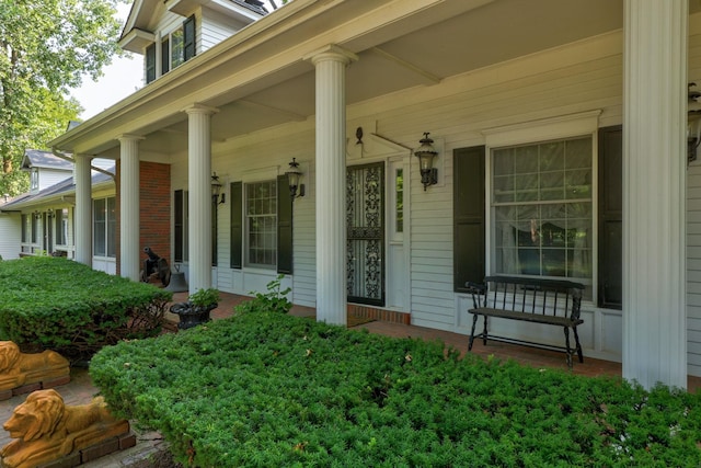 doorway to property featuring a porch