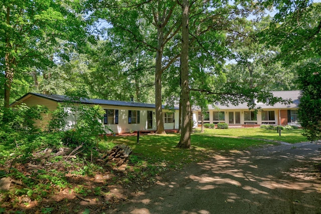 ranch-style house with a front lawn