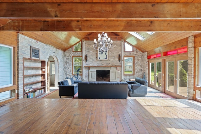 unfurnished living room featuring beamed ceiling, wood ceiling, and high vaulted ceiling