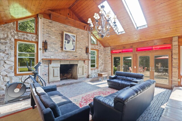 4705 Weiss Rd, Frankenmuth, MI 48734 - living area featuring high vaulted ceiling, a brick fireplace, a skylight, plenty of natural light, and a chandelier
