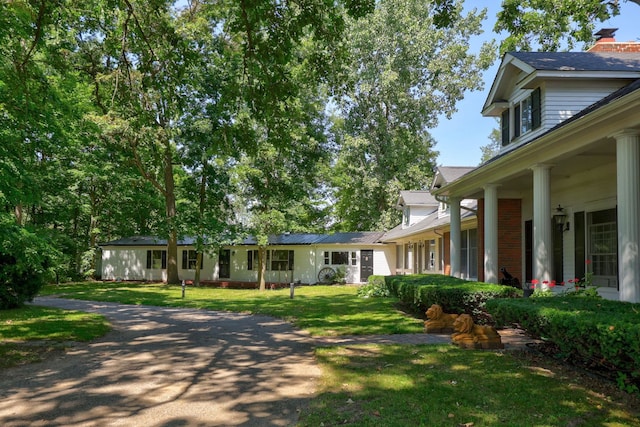 4705 Weiss Rd, Frankenmuth, MI 48734 - view of front of property with a front lawn and a chimney
