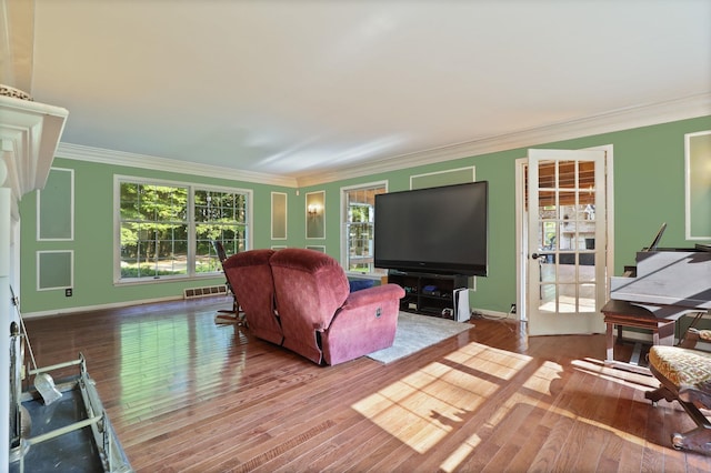 living room featuring ornamental molding and hardwood / wood-style flooring