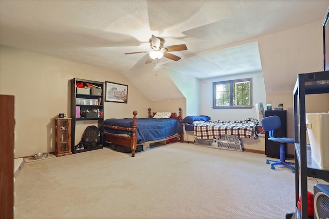 carpeted bedroom featuring a textured ceiling, ceiling fan, and vaulted ceiling