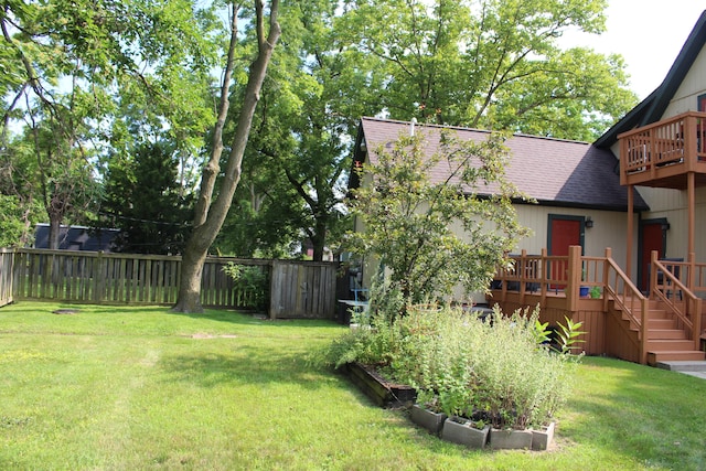 view of yard featuring a wooden deck