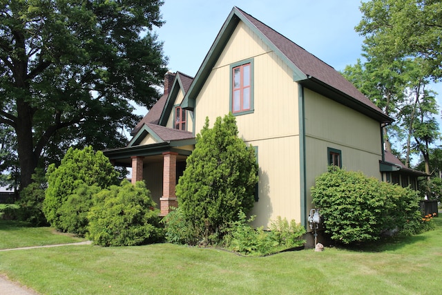 view of property exterior featuring a lawn