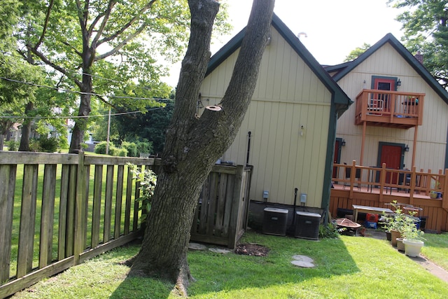 exterior space with a lawn and central air condition unit