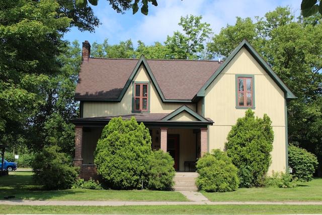 tudor house featuring a front lawn