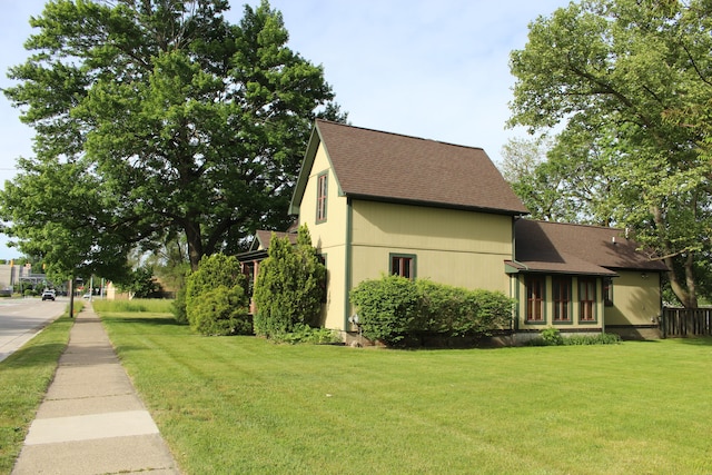 view of home's exterior featuring a yard