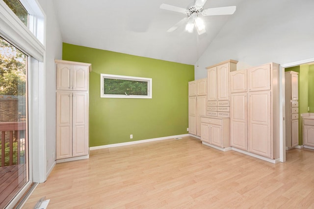 unfurnished bedroom featuring high vaulted ceiling, ensuite bathroom, ceiling fan, access to exterior, and light hardwood / wood-style floors