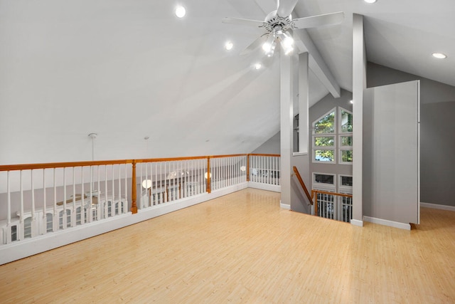 bonus room featuring vaulted ceiling with beams, light hardwood / wood-style floors, and ceiling fan