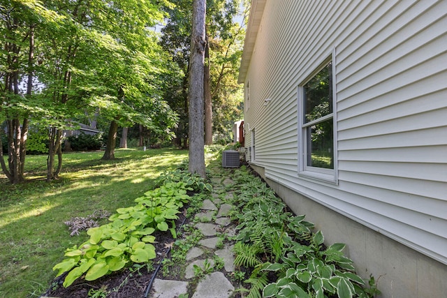 view of yard with central AC unit