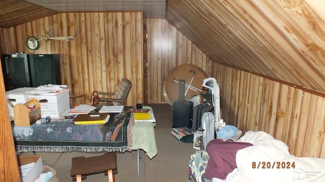 interior space featuring lofted ceiling and wooden walls