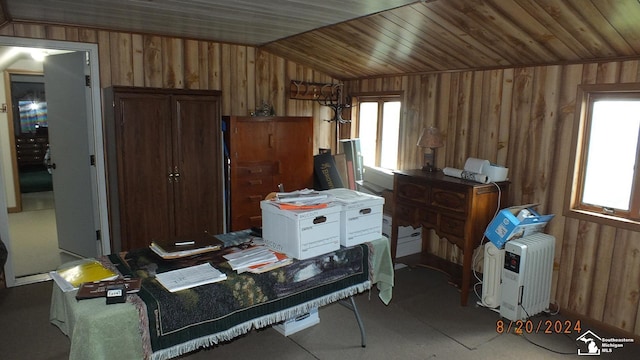 office space featuring wood walls, wood ceiling, and lofted ceiling