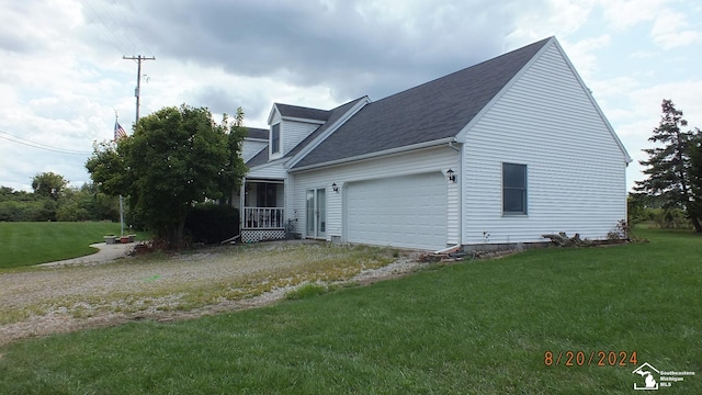 view of home's exterior with a yard and a garage