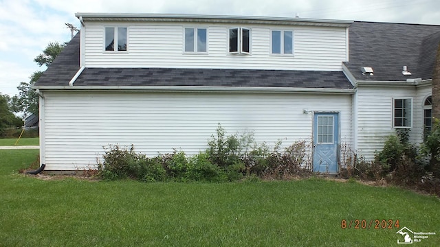 view of property exterior featuring a yard