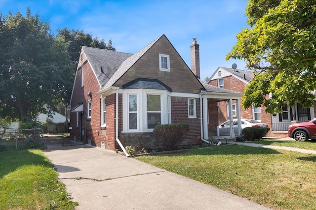 bungalow-style house featuring a front yard