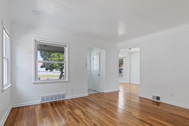 empty room with wood-type flooring