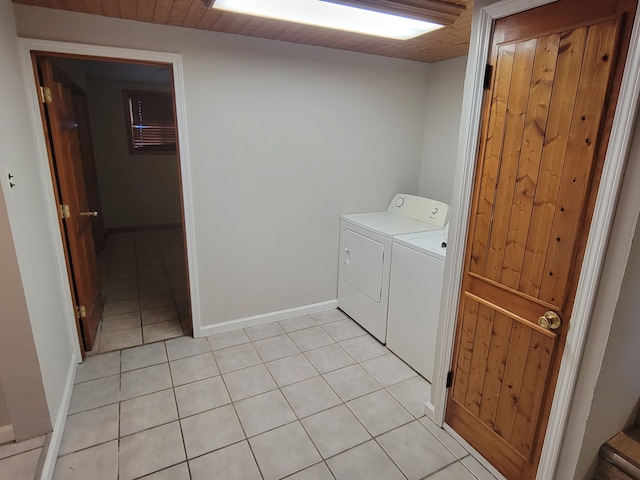 clothes washing area featuring separate washer and dryer and light tile patterned flooring