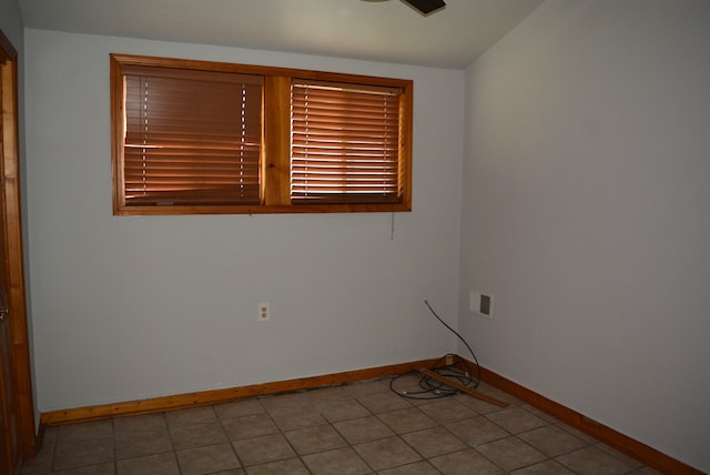 view of tiled spare room