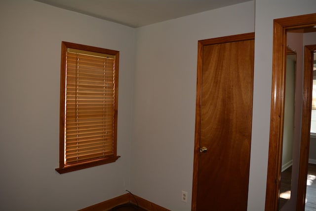 unfurnished room with hardwood / wood-style flooring