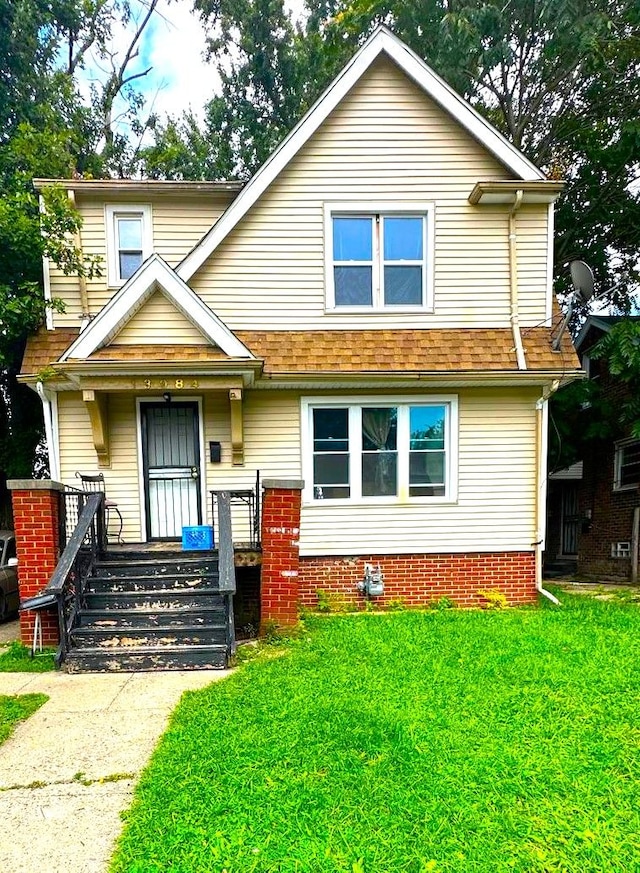 view of front facade with a porch and a front yard