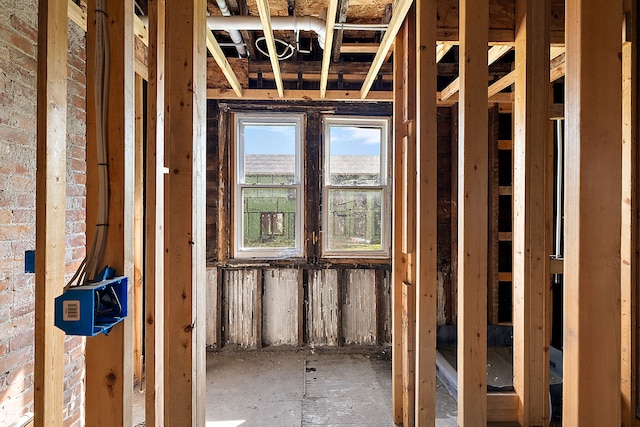 miscellaneous room featuring brick wall