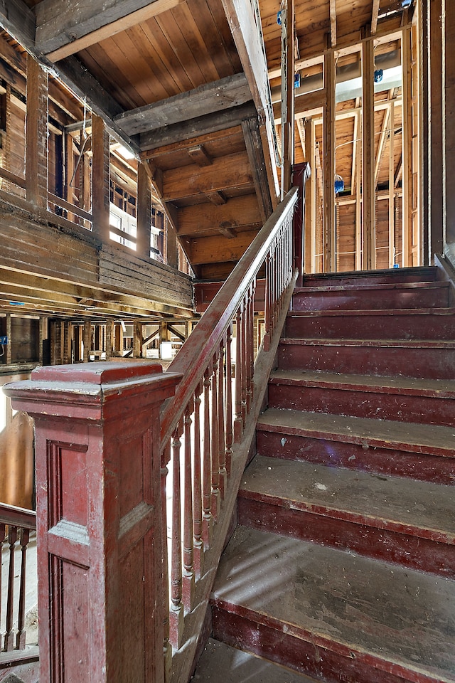 stairs with vaulted ceiling