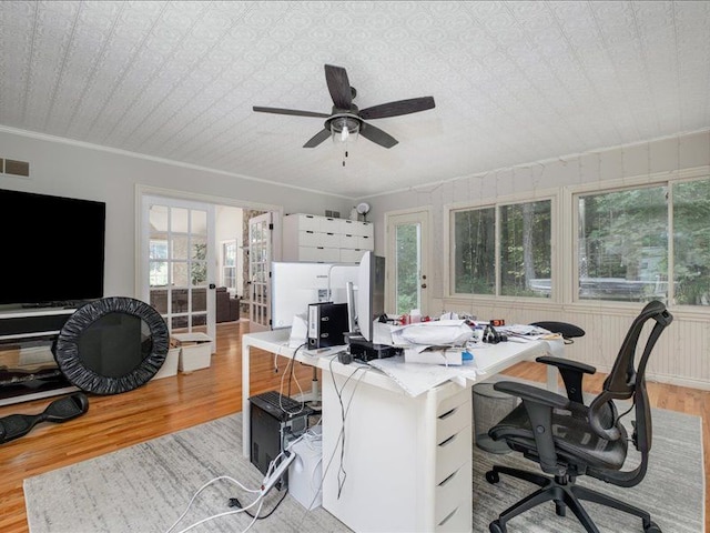 home office with ceiling fan, light hardwood / wood-style flooring, and ornamental molding