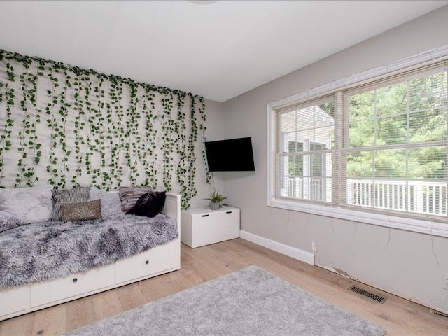 bedroom with light wood-type flooring