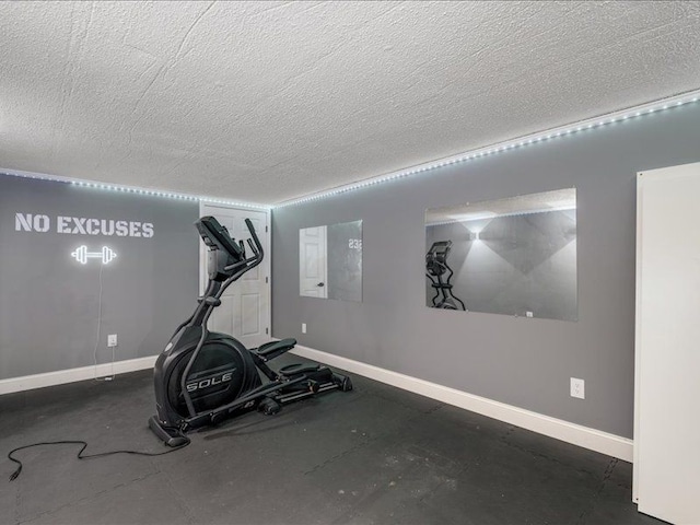 workout area with a textured ceiling