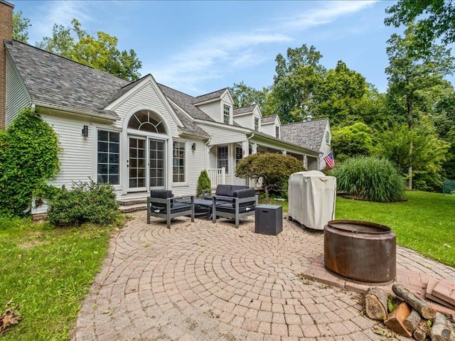 back of house with a patio area, a yard, and an outdoor hangout area