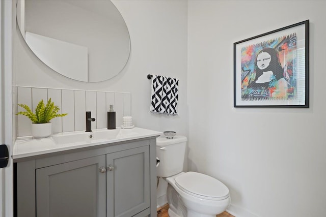 bathroom with vanity and toilet